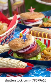 Hot Dogs, Corn And Burgers On 4th Of July Picnic In Patriotic Theme