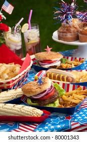 Hot dogs, corn and burgers on 4th of July picnic in patriotic theme
