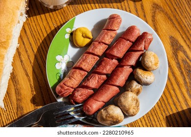 Hot dogs with mushrooms on a plate... - Powered by Shutterstock