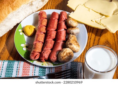 Hot dogs with mushrooms on a plate... - Powered by Shutterstock