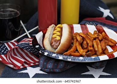 Hot Dogs With Mustard At A 4th Of July BBQ Picnic. Extreme Shallow Depth Of Field With Selective Focus On Wieners.