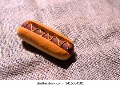 hot dogs are on the surface of the brown fabric - Shutterstock ID 1416034181