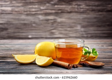 Hot Drink With Honey And Lemon For Cough Remedy On Wooden Table