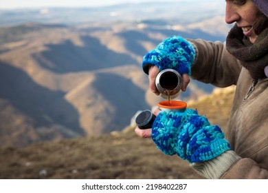 Hot Drink From A Thermos For A Female Hiker In Winter Morning Hours Outdoors