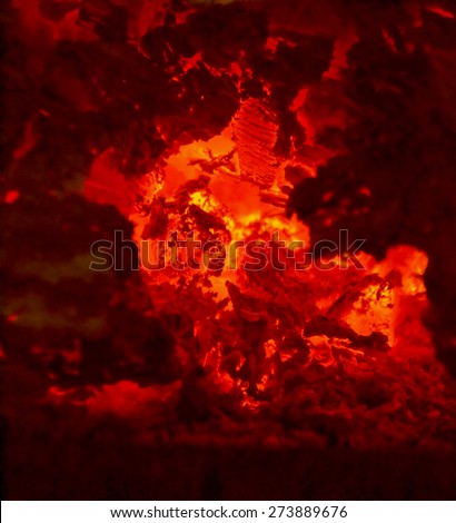 Hot embers in a fireplace. infernal and hellish background
