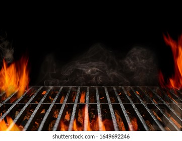 Hot empty portable barbecue BBQ grill with flaming fire and ember charcoal on black background. Waiting for the placement of your food. Close up - Shutterstock ID 1649692246