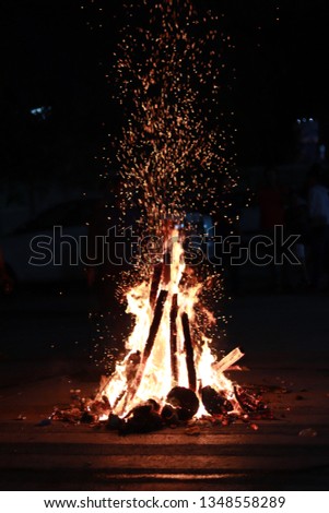 A hot fire in cold nights. It's not a bonfire rather a festival evening in the remembrance of Prince Prahalad who passed the fire test over her aunt Holika who had boon of not getting burned in fire.