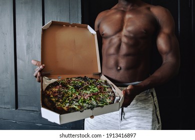 Hot Food Delivery. Every Woman's Dream. Pumped Up Handsome Black Man Holding Pizza. Cubes On The Stomach.