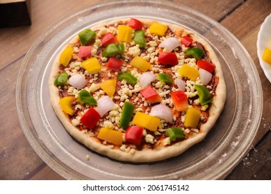 Hot Fuming Pizza On A Wooden Table With Cheese Stretch ,cheese String With All The Ingredients Closeup With Selective Focus And Blur