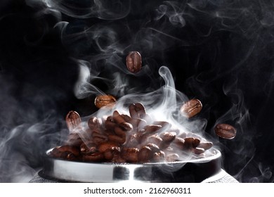 
Hot grain macro shot. Coffee beans on a black background. Roasted coffee beans with smoke. - Powered by Shutterstock