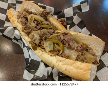 Hot Greasy, Philly Cheesteak Topped with Grilled Onion, Peppers and Cheese
