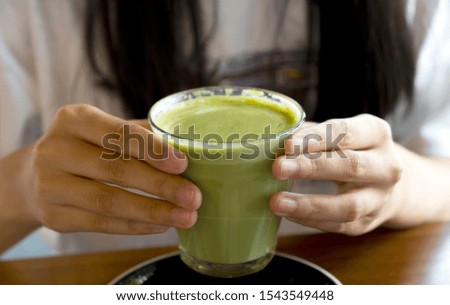 Similar – Image, Stock Photo Matcha latte art with succulent at a coffee shop on a table