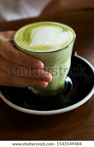 Similar – Image, Stock Photo Matcha latte art with succulent at a coffee shop on a table