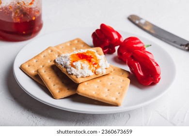 Hot habanero sauce with cream cheese on crackers - Powered by Shutterstock