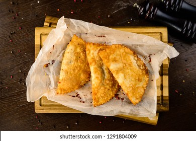 hot homemade pasties on a wooden board copy space - Shutterstock ID 1291804009