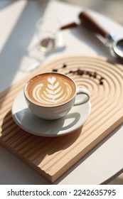 hot latte with latte art - Shutterstock ID 2242635795