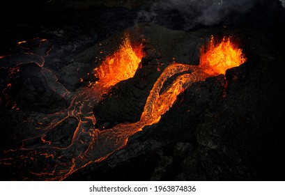 Hot lava flowing in rocky terrain - Powered by Shutterstock