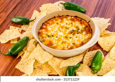 Hot Layered Bean Dip With Jalapenos, Sour Cream And Melted Cheddar Cheese