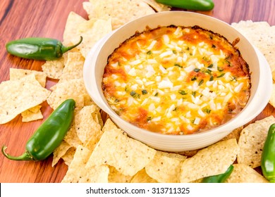 Hot Layered Bean Dip With Jalapenos, Sour Cream And Melted Cheddar Cheese