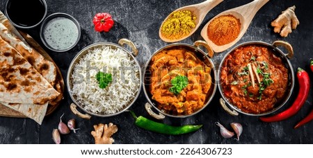 Hot madras paneer and vegetable masala with basmati rice served in original indian karahi pots.