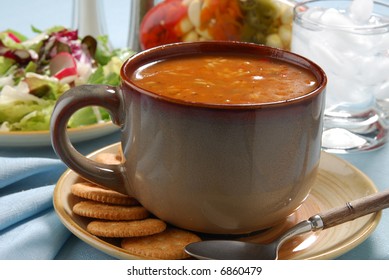 A Hot Meal Of Chicken Gumbo Soup And Salad