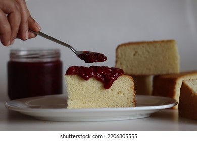 Hot Milk Cake Served With Fresh Homemade Strawberry Sauce On Top. Traditional Milk Sponge Cake. Good As A Base Cake For Decoration