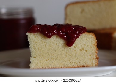 Hot Milk Cake Served With Fresh Homemade Strawberry Sauce On Top. Traditional Milk Sponge Cake. Good As A Base Cake For Decoration