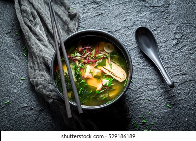 Hot Miso Soup With Salmon In Black Bowl