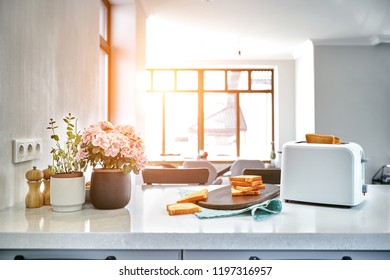 Hot Morning In A White Kitchen With Fresh Toast. Sun Flare