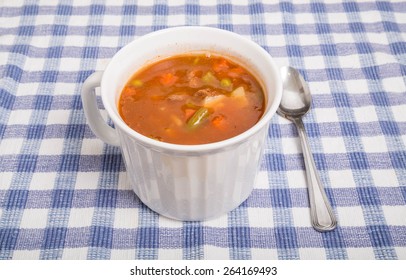 A Hot Mug Of Beef And Vegetable Soup