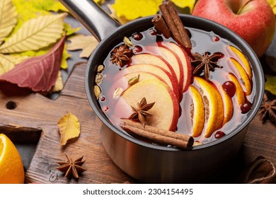 Hot mulled wine with fruits and spices. Autumn cocktail