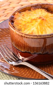 Hot From The Oven Homemade Shepherd's Pie With Cheesy Mashed Potatoes In Small Casserole Dish