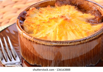 Hot From The Oven Homemade Shepherd's Pie With Cheesy Mashed Potatoes In Small Casserole Dish