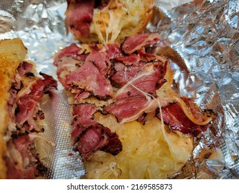 Hot Pastrami And Sauerkraut And Melted Cheese Sandwich On Foil