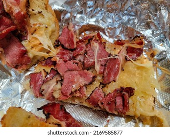 Hot Pastrami And Sauerkraut And Melted Cheese Sandwich On Foil