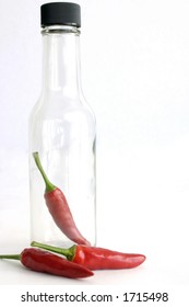 Hot Peppers And Empty Sauce Bottle