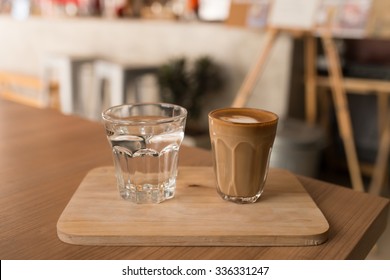 Hot piccolo latte Art in glass shot