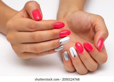 Hot Pink, White, Silver Manicure, With Silver Stripes And Crystals On The Nameless Nails. Short Oval Nails. Close-up On A White Background.