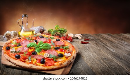 Hot Pizza Served On Old Table