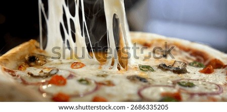 Hot pizza slice pulling a long strand of melted mozzarella cheese, creating a tempting gooey effect and showing appetizing fresh toppings, steam wafting from the crust