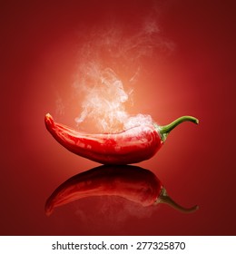 Hot red chili smoking or steaming with reflection - Shutterstock ID 277325870
