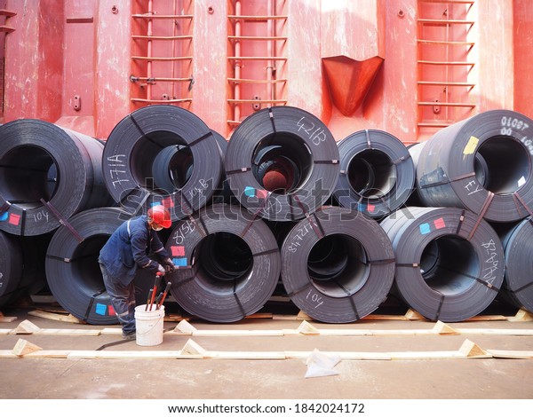 hot rolled coil or steel coils loaded in\
cargo hold of a bulk carrier or cargo\
ship.