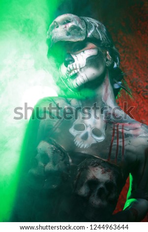 Hot Scary Death BodyArt Woman With 3d sculls Posing In The Green Smoke