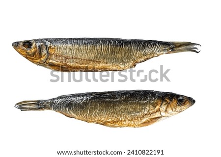 Hot smoked whole herrings on kitchen table. Isolated on white background, top view