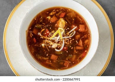 Hot And Sour Veggie Soup On A White Porcelain Plate