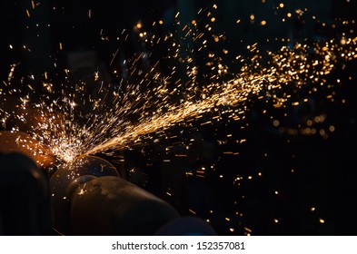 Hot sparks at grinding steel material 