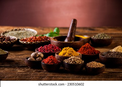 Hot spices in wooden bowls
