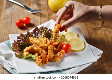 Hot And Spicy Bbq Chicken Strips With Sesame On Wooden Background
