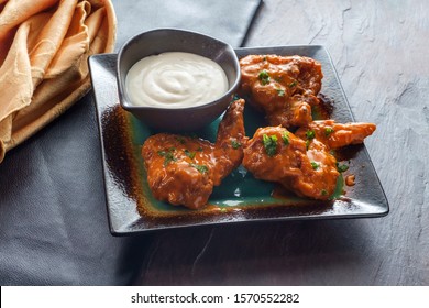 Hot And Spicy Buffalo Wings With Blue Cheese Dipping Sauce