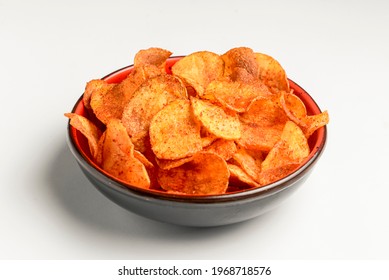 Hot Spicy Potato Chips Bowl Isolated On White, In Red Bowl. Fast Food, Junk Food Concept, Beer Snack. Potato Chips In Hot Spices. Copy Space Banner.